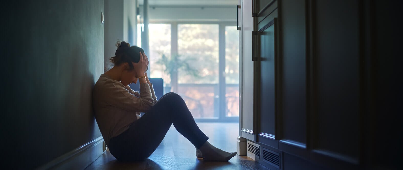 Young Woman experiencing anxiety attacks at home alone.